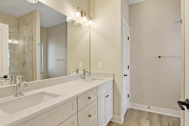 4703 98th St, Pleasant Prairie, WI 53158 - full bathroom with wood finished floors, a shower stall, and a sink