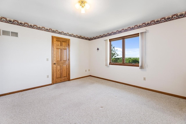 spare room with carpet flooring