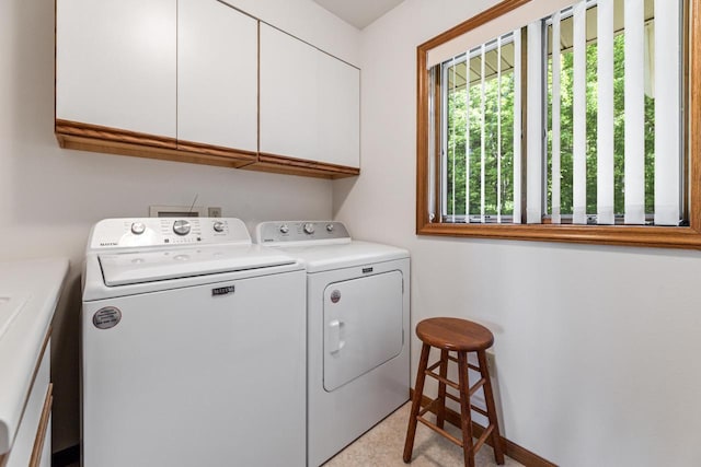 laundry room with cabinets and independent washer and dryer