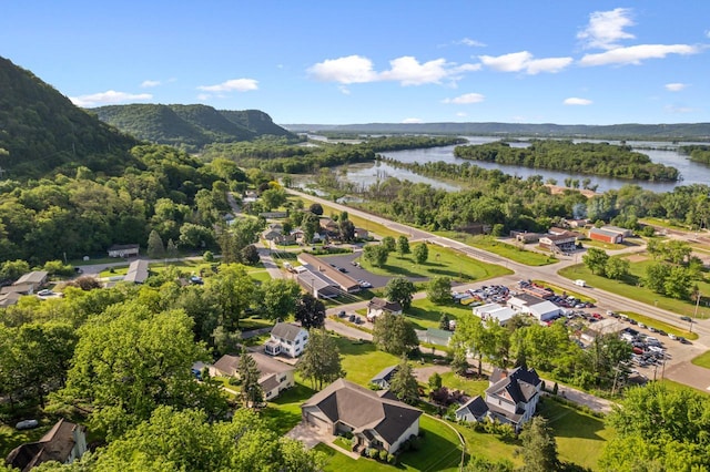 drone / aerial view with a water and mountain view