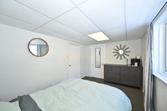 bedroom featuring a drop ceiling