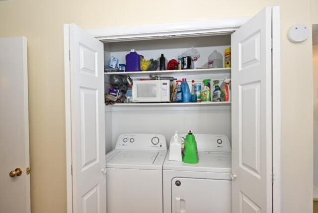 laundry room with washer and clothes dryer