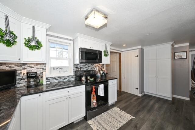 kitchen with black range with electric cooktop, dark hardwood / wood-style floors, white cabinetry, and backsplash