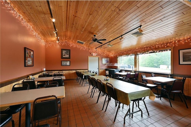 dining space with track lighting, wood ceiling, ceiling fan, tile patterned flooring, and lofted ceiling