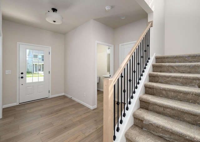 foyer entrance with hardwood / wood-style floors