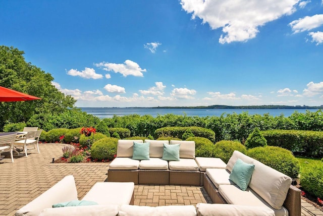 view of patio featuring a water view and an outdoor hangout area