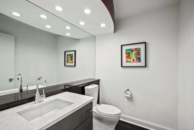 bathroom with tile patterned floors, vanity, and toilet