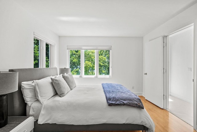 bedroom with light hardwood / wood-style flooring