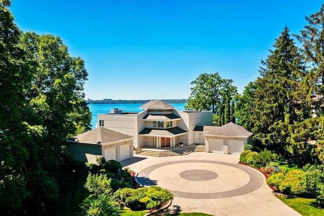 view of front of house with a water view