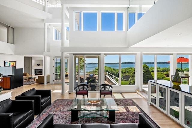 interior space featuring a wealth of natural light and a water view