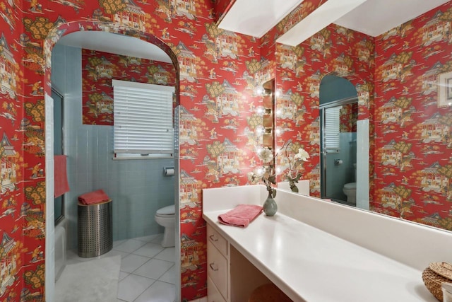 bathroom featuring tile patterned floors, vanity, and toilet