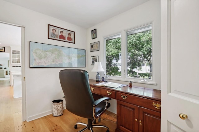 office with light hardwood / wood-style floors