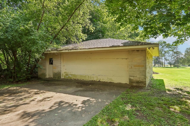 garage with a yard