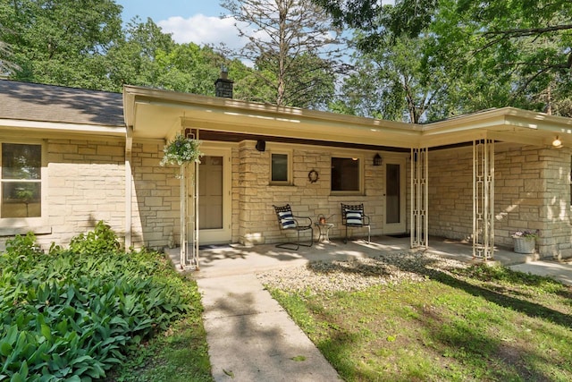 doorway to property with a patio area