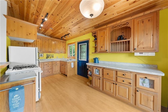 kitchen featuring white appliances, wooden ceiling, sink, rail lighting, and light hardwood / wood-style floors