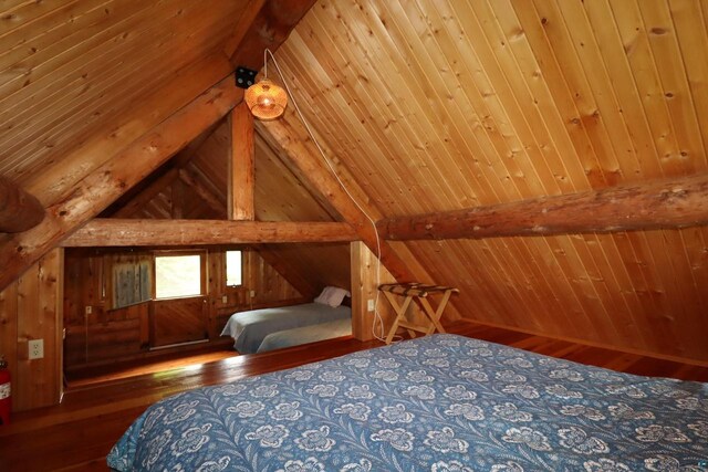 unfurnished bedroom with wood ceiling, vaulted ceiling with beams, wooden walls, and dark wood-type flooring