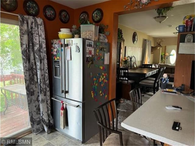 kitchen with stainless steel refrigerator with ice dispenser