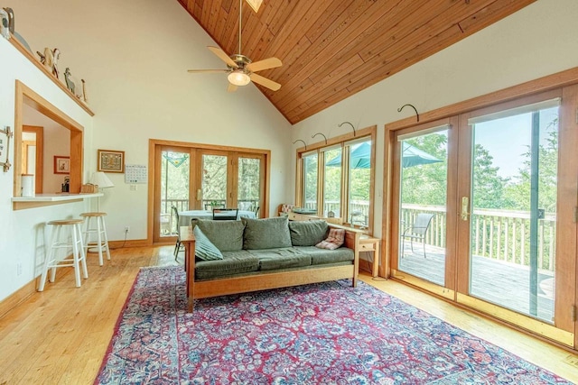 living room with high vaulted ceiling, ceiling fan, wood ceiling, light hardwood / wood-style floors, and french doors