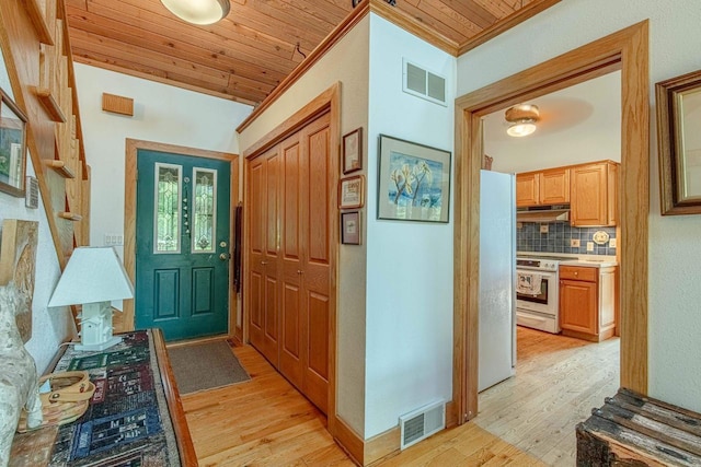 interior space with wood ceiling, crown molding, vaulted ceiling, and light wood-type flooring