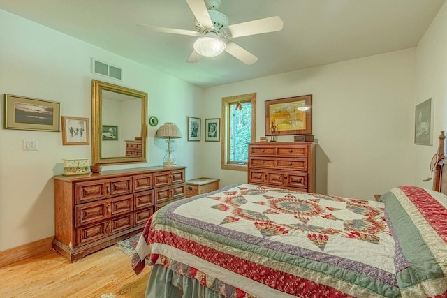 bedroom featuring light hardwood / wood-style floors and ceiling fan