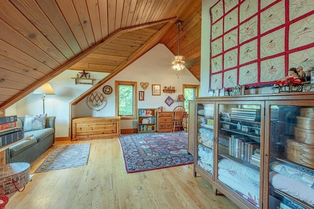 interior space with hardwood / wood-style flooring, lofted ceiling, and wooden ceiling