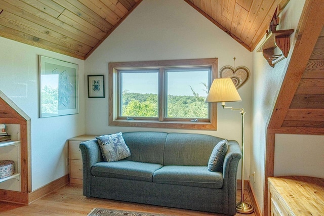 living area with wood ceiling, vaulted ceiling, and light hardwood / wood-style floors