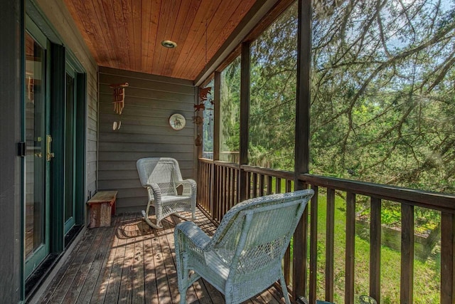 sunroom featuring wood ceiling