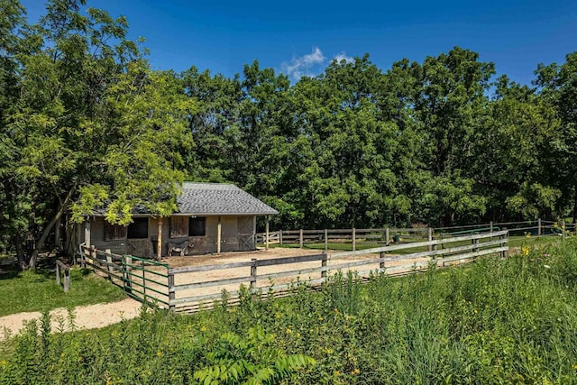 exterior space featuring an outbuilding and a rural view