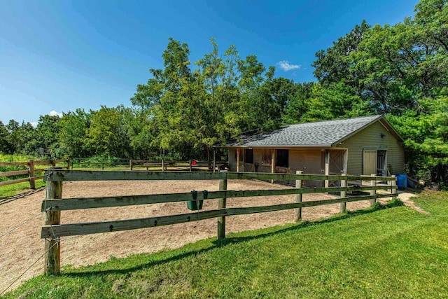 view of stable with a rural view