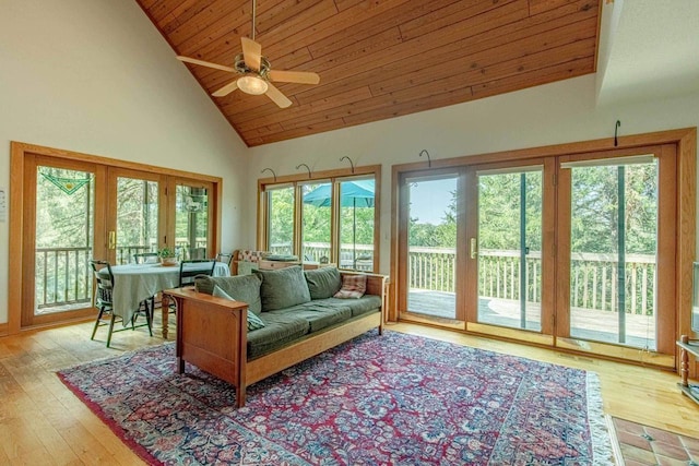 sunroom with lofted ceiling, wood ceiling, plenty of natural light, and french doors