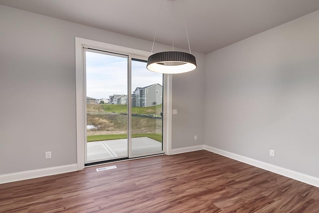 1421 Greenleaf Ct, Sun Prairie, WI 53590 - unfurnished dining area with baseboards and wood finished floors