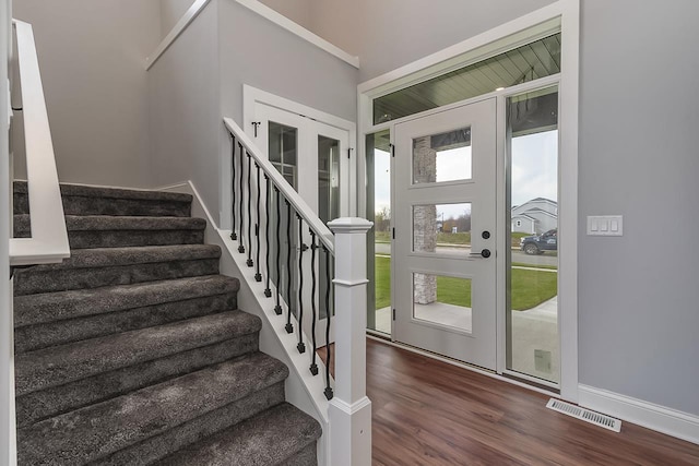 1421 Greenleaf Ct, Sun Prairie, WI 53590 - foyer entrance with stairway, dark wood-type flooring, and baseboards