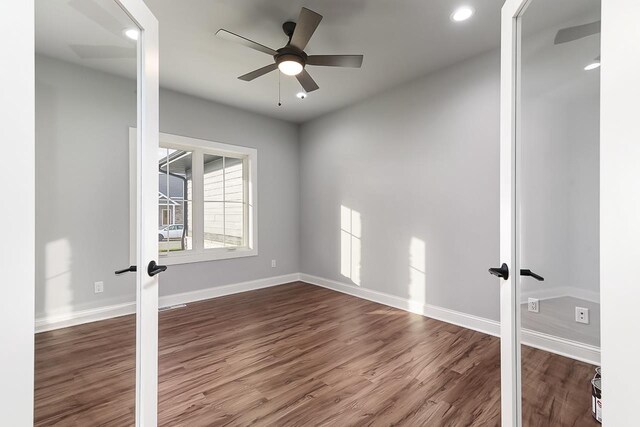 1421 Greenleaf Ct, Sun Prairie, WI 53590 - empty room featuring french doors, dark wood-style floors, baseboards, ceiling fan, and recessed lighting