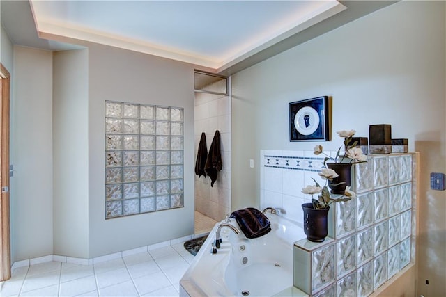 bathroom featuring tile patterned flooring and shower with separate bathtub