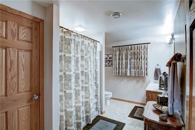 bathroom with vanity and toilet