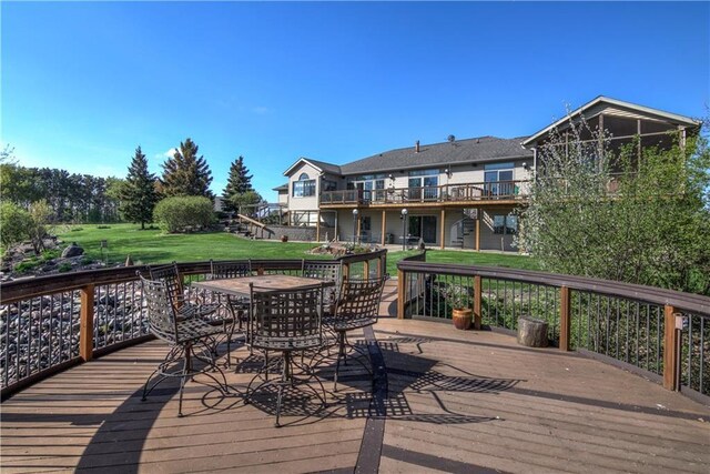 177 Monte Carlo Dr, Eau Claire, WI 54703 - deck featuring stairs, outdoor dining area, and a yard