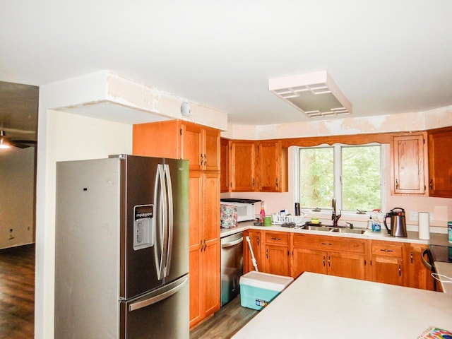 441 Washington St, Oconto, WI 54153 - kitchen with sink, stainless steel appliances, and hardwood / wood-style flooring