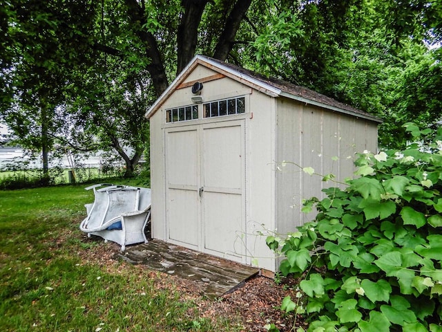 441 Washington St, Oconto, WI 54153 - view of outbuilding with a lawn