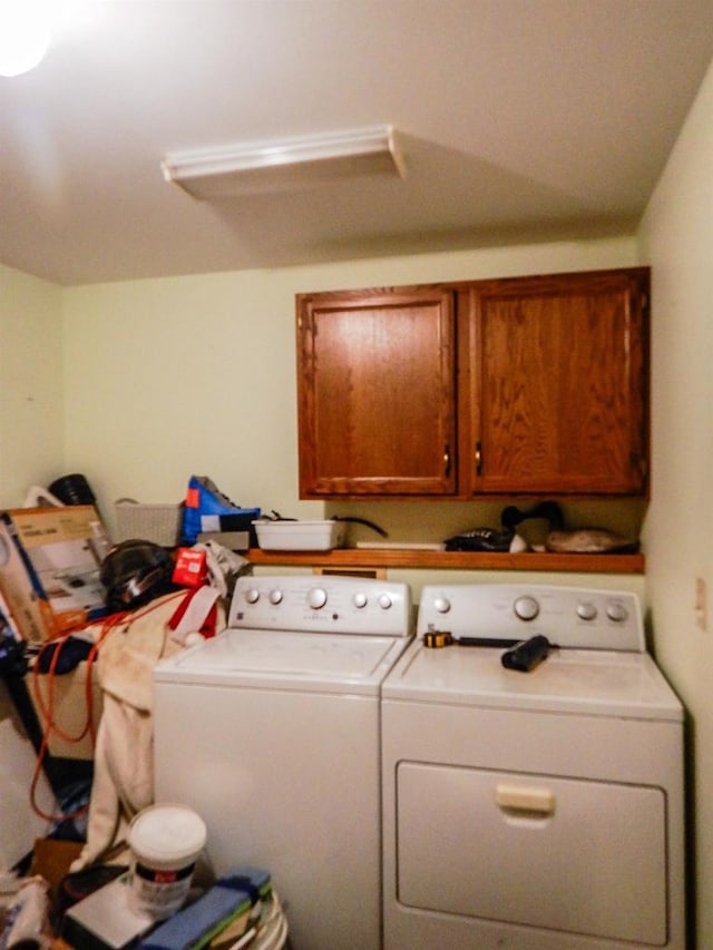 441 Washington St, Oconto, WI 54153 - washroom featuring washing machine and dryer and cabinets