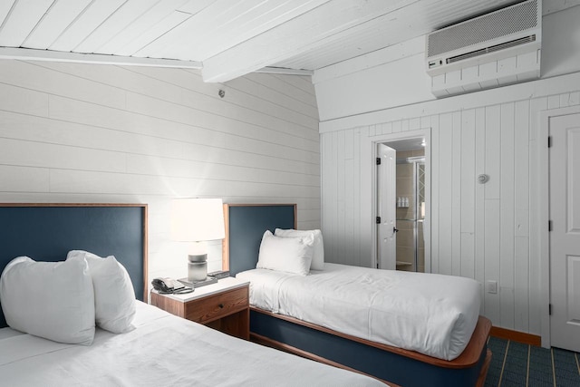 bedroom with lofted ceiling with beams, an AC wall unit, and wood walls