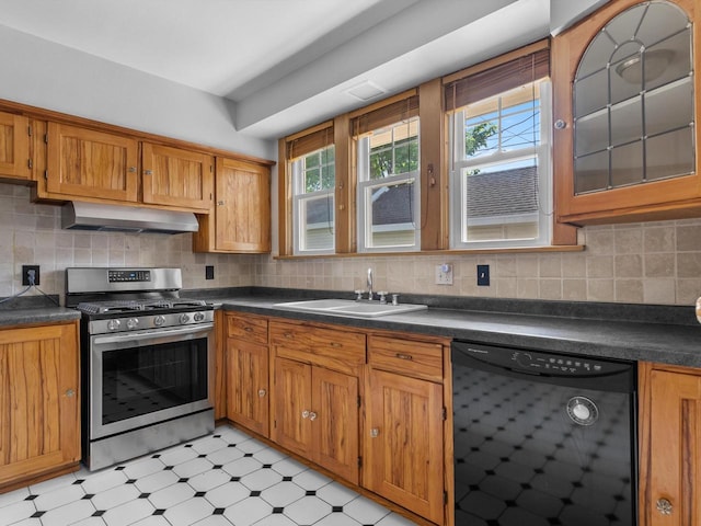 kitchen with decorative backsplash, sink, stainless steel range with gas cooktop, and black dishwasher