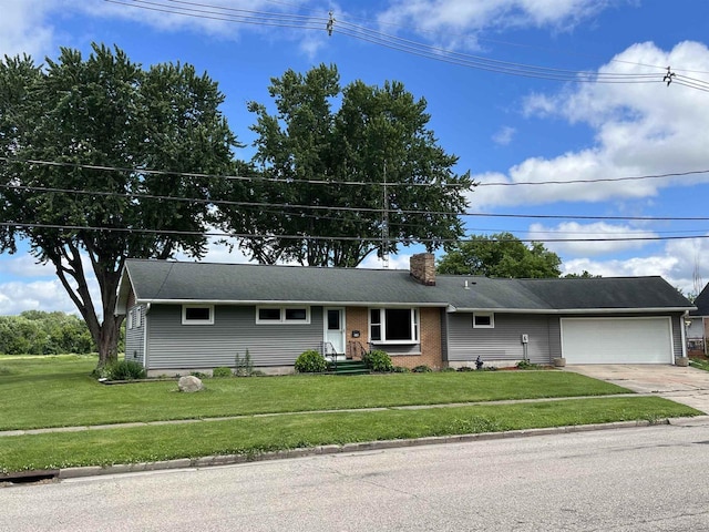 single story home with a garage and a front lawn