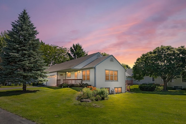 exterior space featuring a yard and a garage