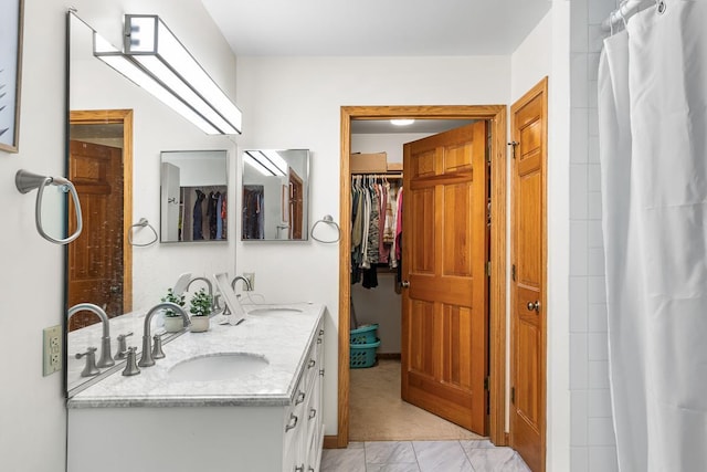 bathroom with vanity and curtained shower