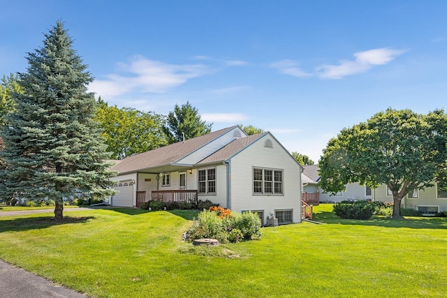 exterior space featuring a front yard and an attached garage