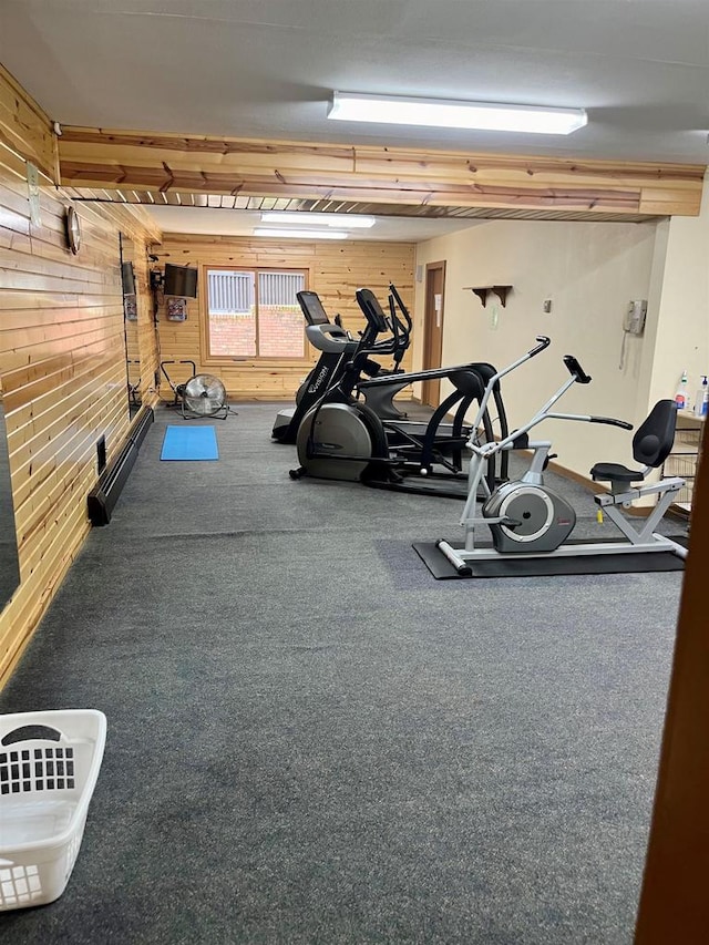 exercise room with wood walls