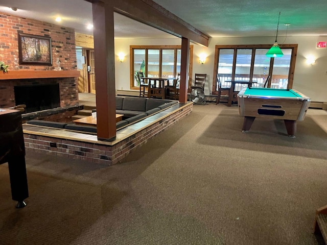 recreation room with a fireplace, baseboard heating, light carpet, and pool table