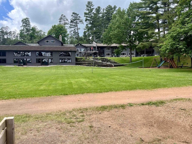 surrounding community featuring a lawn and a playground