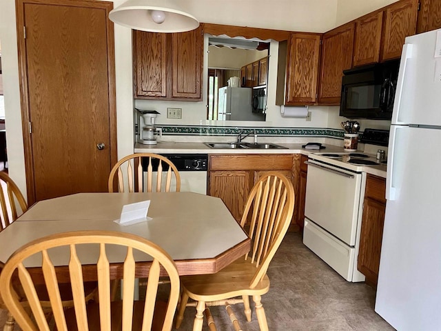 kitchen with sink and white appliances