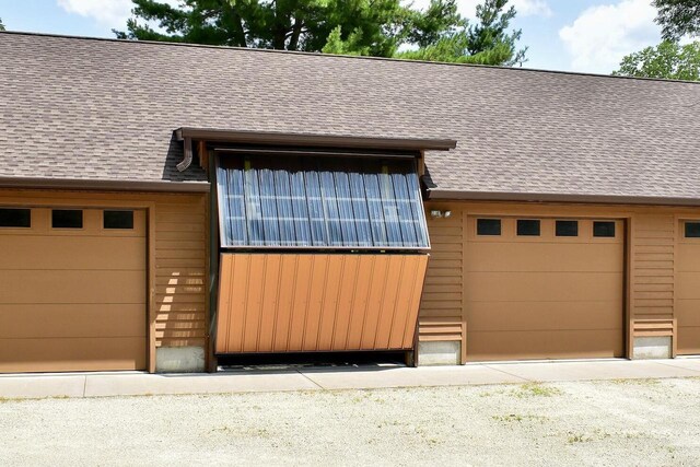 view of front of home featuring roof with shingles